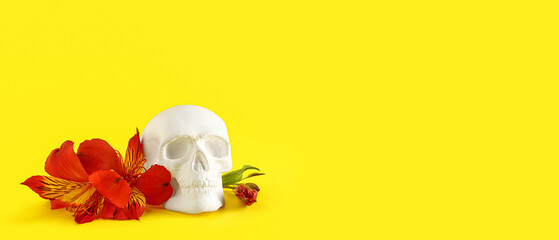 Human skull with beautiful alstroemeria flowers on yellow background with space for text