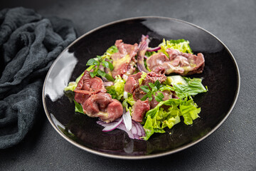 chicken stomach salad green lettuce, onion, salad dressing vegetable meal food snack on the table copy space food background rustic top view