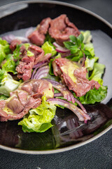 chicken stomach salad green lettuce, onion, salad dressing vegetable meal food snack on the table copy space food background rustic top view