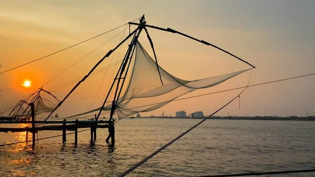 Chinese fishing net at sunrise in Cochin, Kerala, India. Famous landmark in Fort Kochi