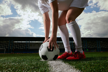 the football player sets the ball on the football field, the beginning of the football match