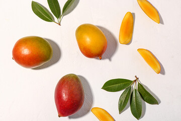 Fresh ripe mangoes on white  background