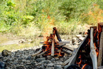 Camping fire site for outdoors cooking, adventure background