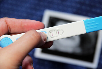 Positive pregnancy test with two stripes