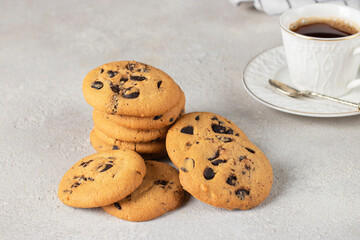Homemade shortbread with chocolate and cup of coffee on a gray background