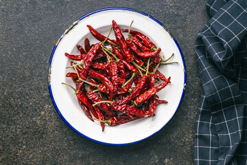 Red chili peppers in bowl. Top view.