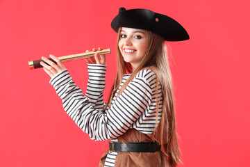 Beautiful female pirate with spyglass on red background - obrazy, fototapety, plakaty
