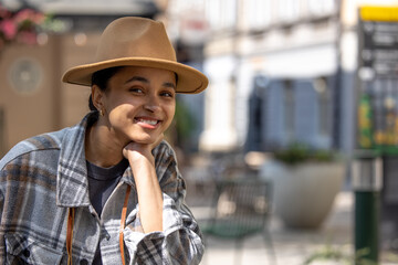 Pretty smiling girl in a straw hat