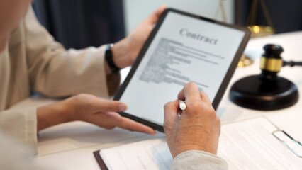 Business people hand electronic Signature on Tablet with contract policy .