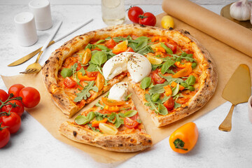 Tasty pizza with Burrata cheese on light background