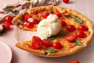 Plate of tasty pizza with Burrata cheese on pink tile