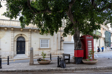 Red phone box on the streets of St. Julian's in Malta