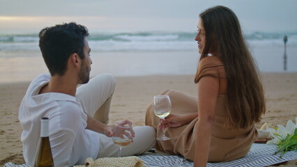 Sensual couple celebrating vacation seashore. Romantic family clinking glasses