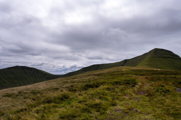 View of Cribyn from Bryn Teg ridge on a cloudy summer afternoon, in the Brecon Beacon or Bannau Brycheiniog national park, Powys, Wales
