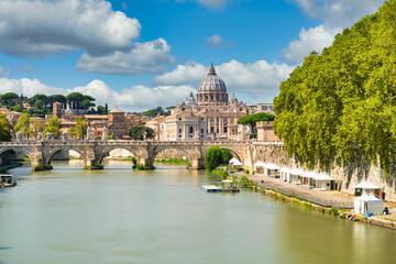 St.Peter's basilica viewed across Tiber river in Vatican, Rome. Italy