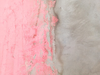 old wall background. Meeting between pink and gray walls. Pink and gray walls. Cement. Abstract color gradient
