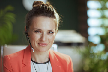 Portrait of modern business woman at work in red jacket