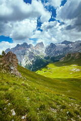 Fototapeta premium landscape with mountains, hills, clouds and grass