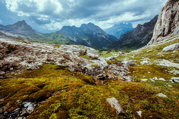 landscape with mountains, clouds and rocks