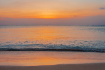 Naklejka na ściany i meble Tropical beach at sunset.