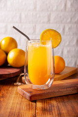Refreshing homemade orangeade, a natural hydrating drink made from orange juice, very popular in several countries, ideal to drink in hot summers.