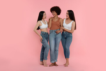 Portrait of beautiful young women on pink background