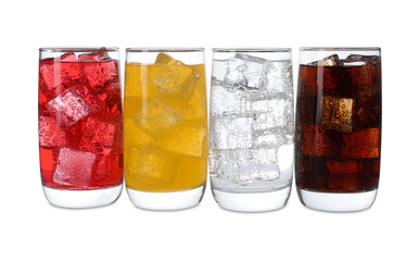 Glasses of different refreshing soda water with ice cubes isolated on white