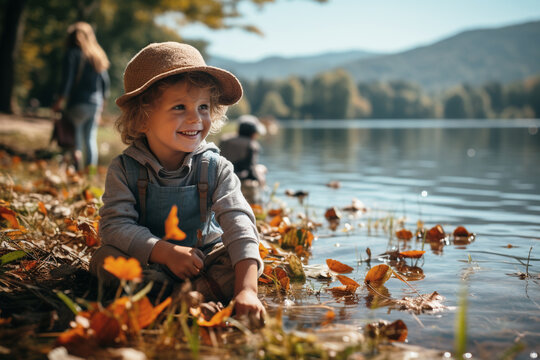 kids happily gather on the bank of the lake during a family trip outdoors in autumn, marveling at the vibrant foliage, enjoying the crisp air, beauty of nature