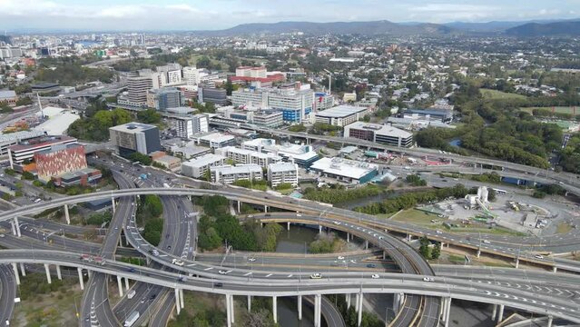 Aerial drone pullback reverse view of the Bowens Hill Interchange in Bowen Hills, Brisbane, Queensland Australia