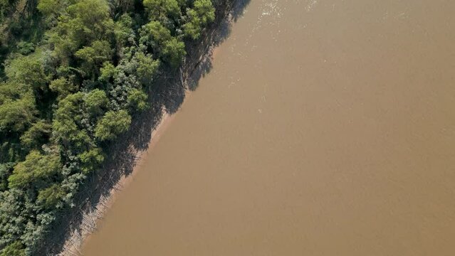 Drone footage of the forest and huge river and lifeline Rio Paran&aacute; in the Province Entre Rios in the Argentinian Mesopotamia - Traveling South America - natural look