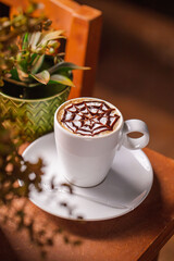 cup of coffee with chocolate and cinnamon