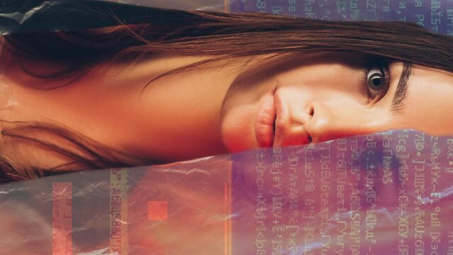 Vertical video. Cyber security. Personal data protection. Double exposure of disturbed woman face peeping out from behind colorful glitch encryption animation.