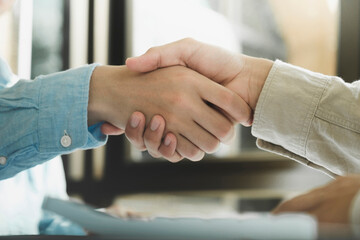 Businessmans handshake after good deal.