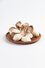 king oyster mushroom on wood plate, 새송이버섯 정면사진