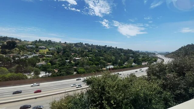 Incredible panning right view of the Interstate 405 from the moving tram Getty Center in Los Angeles Southern California.