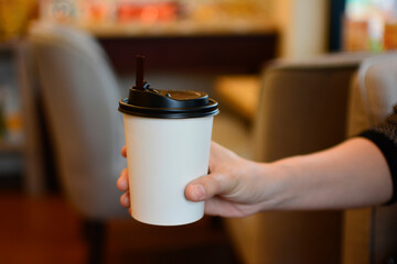 Coffee is hot coffee in a paper cup.