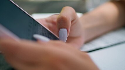 Female fingers texting smartphone close up. Unrecognized woman typing message