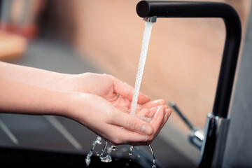 Running water over hands, daily privilege
