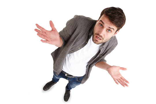 Confused, shrug and above man portrait with why on isolated, transparent and png background. Top view, face and guy model with doubt, questions or choice, decision and whatever, emoji or dont know