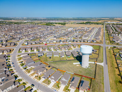 Aerial photo Manor Texas neighborhood homes with water tower community development