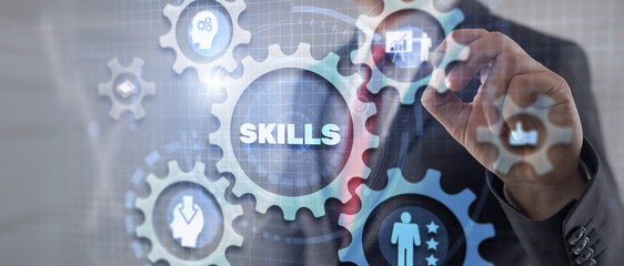 Businessman click on skills on virtuas screen. Mixed Media