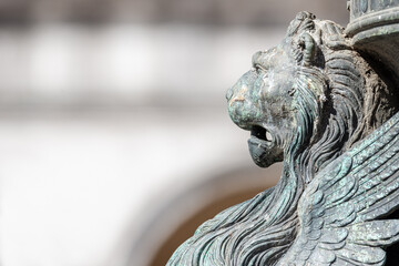 Ancient decoration element of a scary lion head with wings in Venice historical and touristic...
