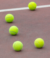 Yellow balls on the tennis court. Sport
