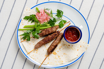 beef kebab with hot sauce