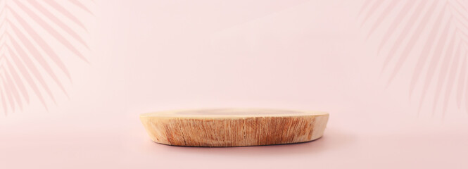 Wooden board over pastel color background. For cosmetics, aesthetics, and objects mockup