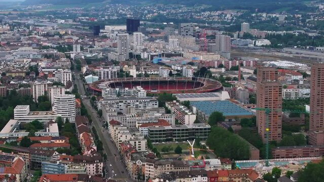 Aerial footage of apartment houses in residential urban borough and Letzigrund stadium. Zurich, Switzerland
