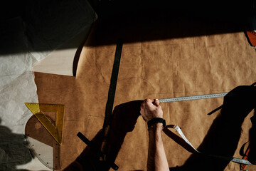 Tailor measuring clothing pattern