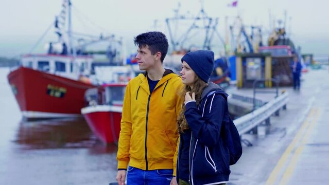 Young couple in the town of Dingle in Ireland - slow motion clip 