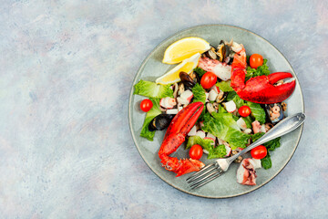 Seafood salad on a plate, copy space