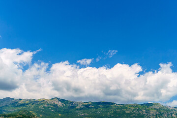 Obraz premium beautiful mountains, summer landscape, clouds, forest on the hillsides
